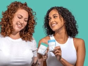 Two women holding Happy V wellness products in a bright lifestyle scene