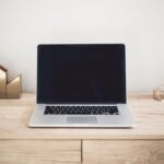 Laptop on a desk in a home workspace