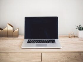 Laptop on a desk in a home workspace