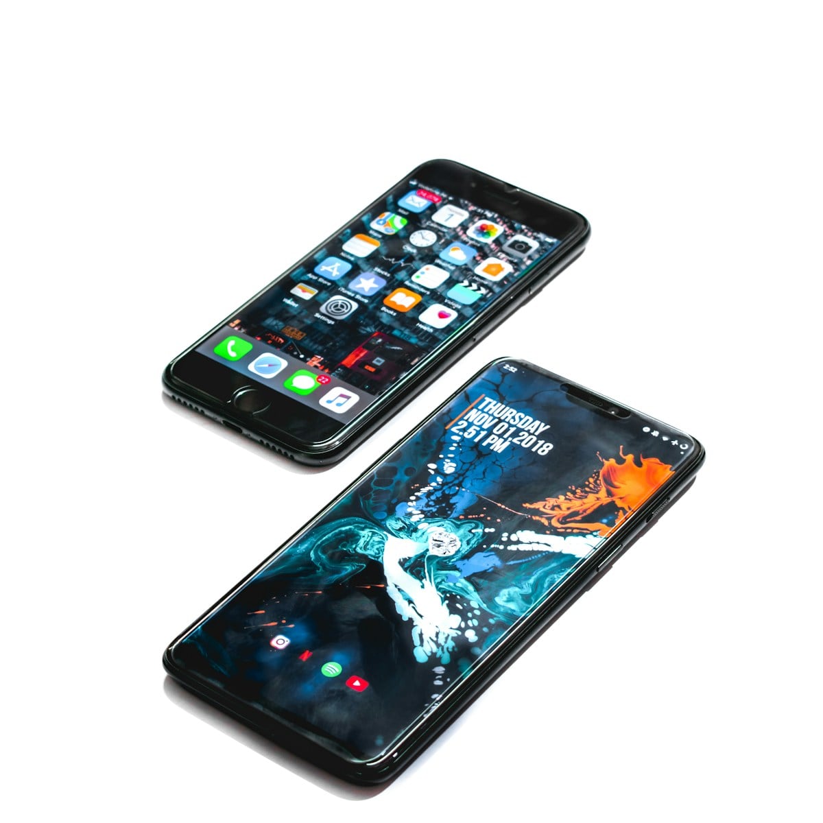 Two smartphones on a white background