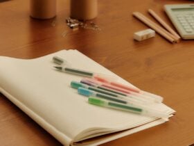 MUJI stationery arranged on a wooden desk