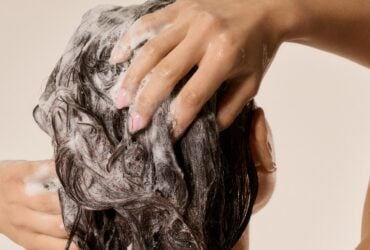 Close-up of hair being washed with shampoo lather