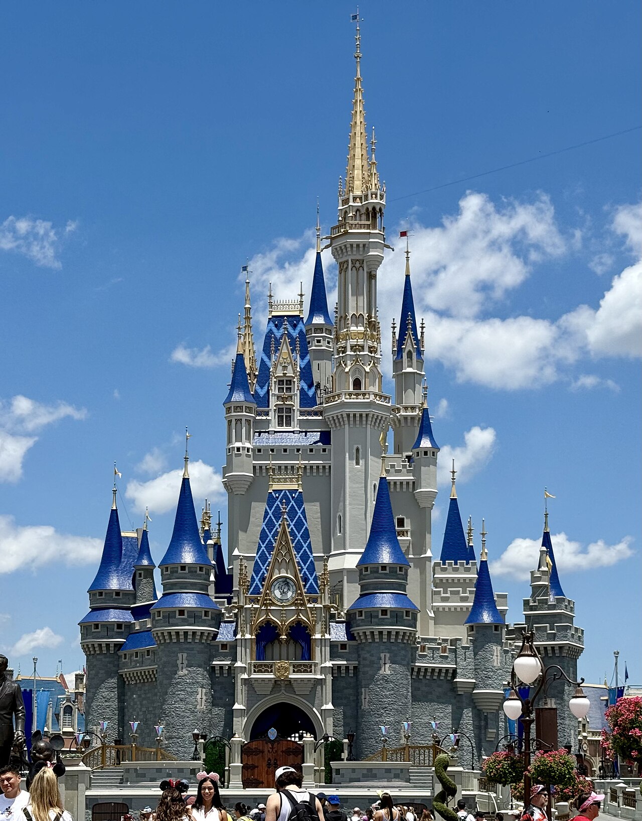 Colorful theme park entrance with guests