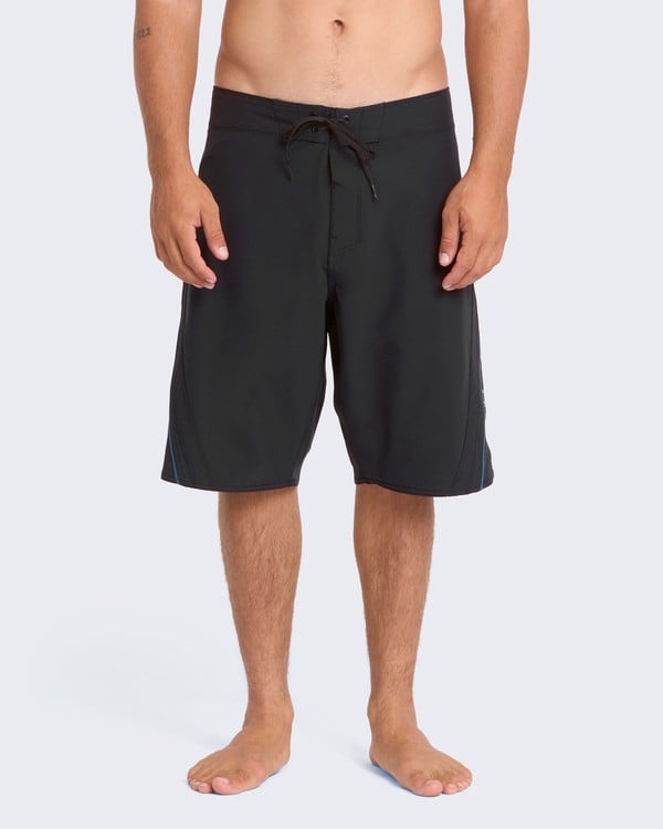 Model wearing purple Fluid 2K Pro boardshorts