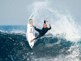 Surfer carving a turn on a wave in a Billabong surf campaign