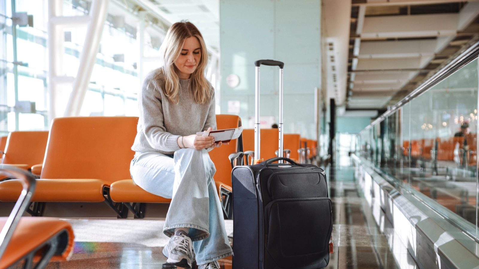Passenger checking a boarding pass before travel