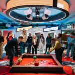 Visitors playing together at Monopoly Lifesized in London
