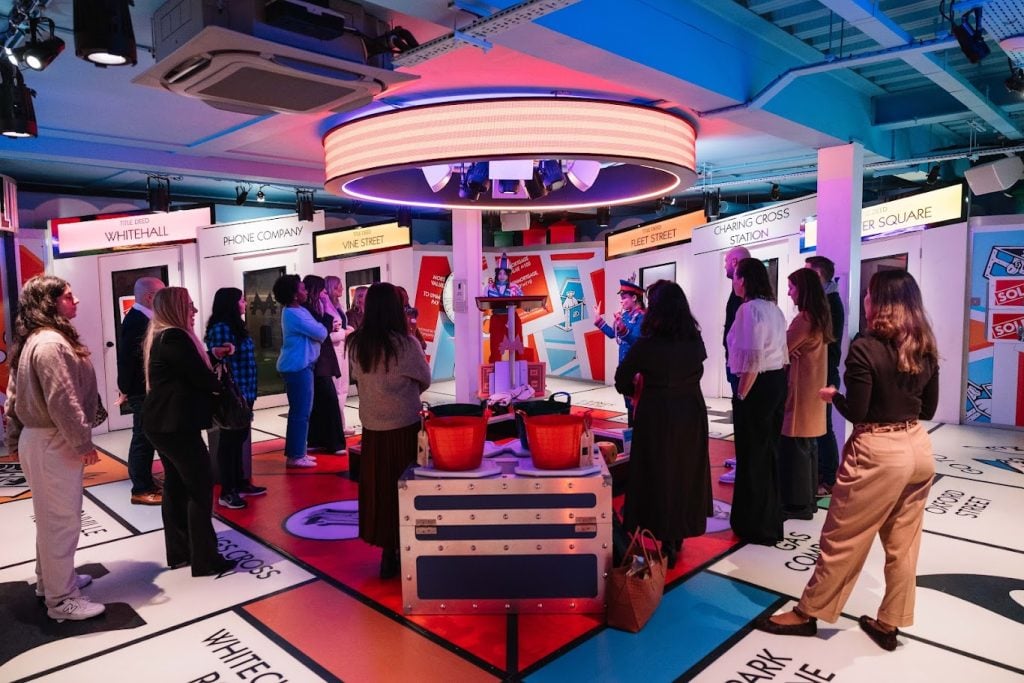 A group taking part in a Monopoly Lifesized challenge