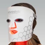 Person wearing a red light therapy mask