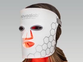 Person wearing a red light therapy mask