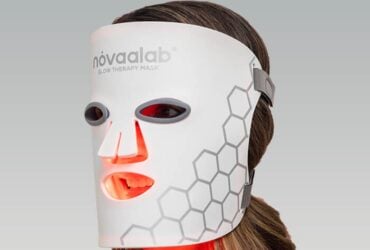 Person wearing a red light therapy mask