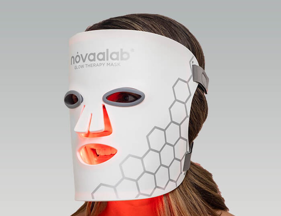 Person wearing a red light therapy mask