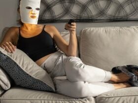 Person wearing an LED face mask during a home light therapy session