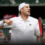 Tennis player celebrating on court