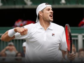 Tennis player celebrating on court