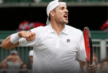Tennis player celebrating on court