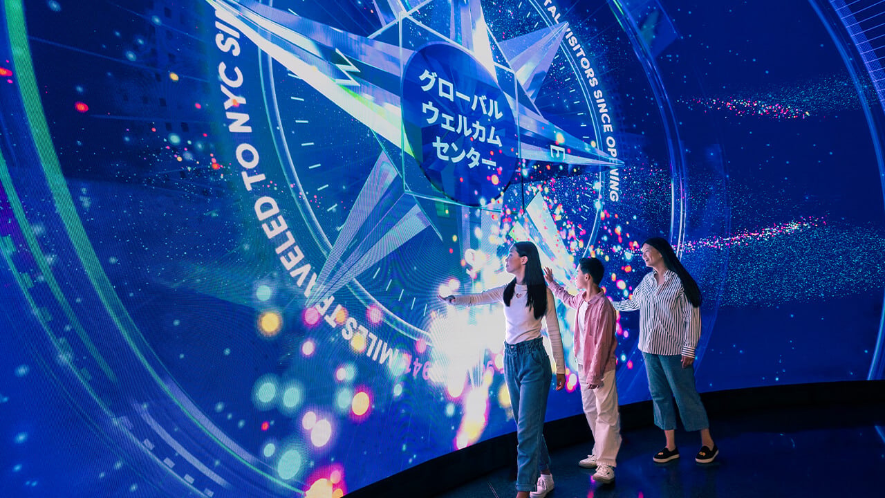 Visitors exploring the Horizon Grid LED display