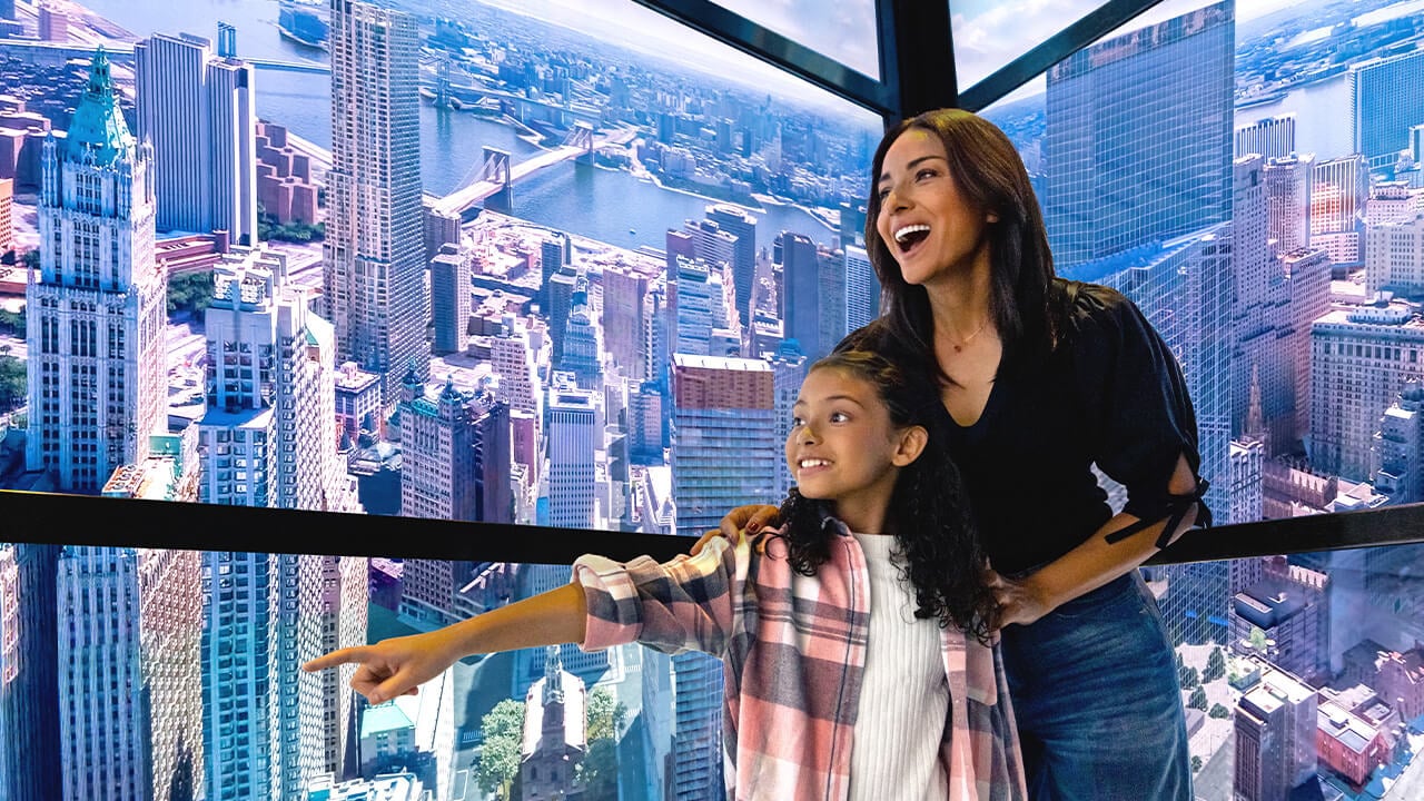 Two visitors inside the SkyPod elevator at One World Observatory