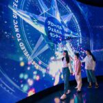 Visitors at the One World Observatory welcome wall