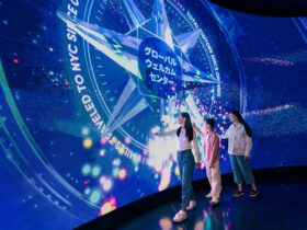 Visitors at the One World Observatory welcome wall