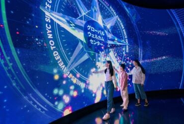 Visitors at the One World Observatory welcome wall