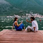 Couple standing together outdoors on a travel insurance page