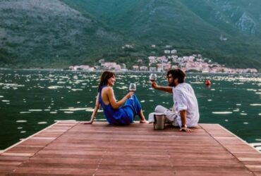 Couple standing together outdoors on a travel insurance page