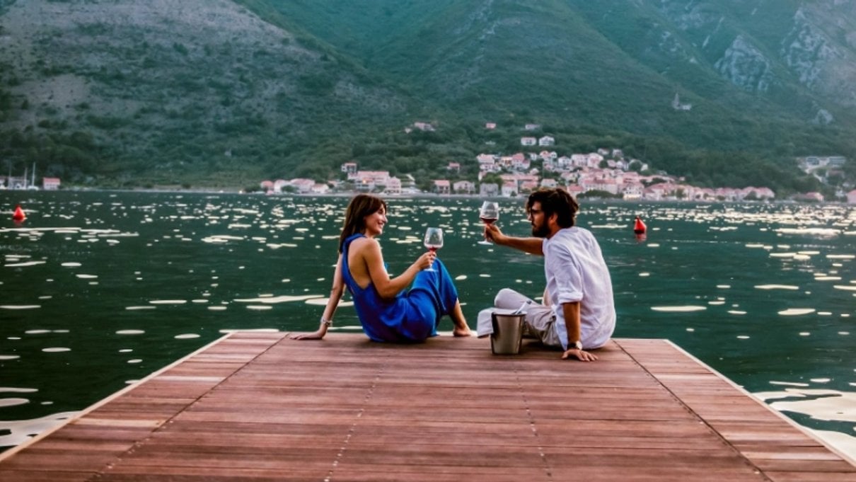 Couple standing together outdoors on a travel insurance page