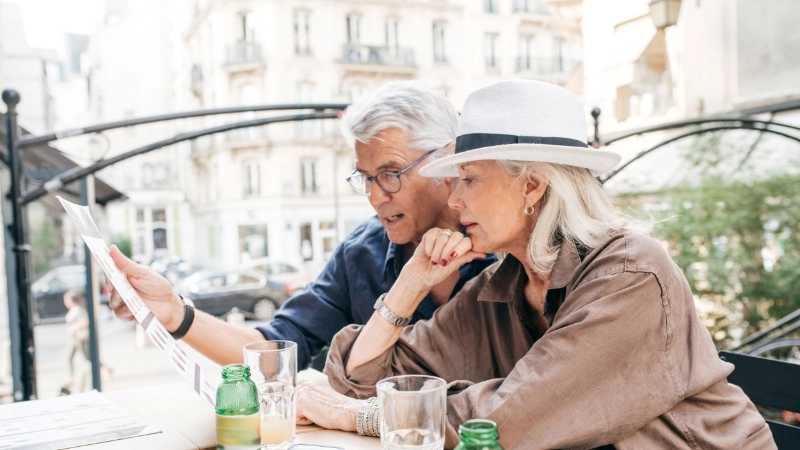 Older travellers pictured on an age-specific travel insurance cover page