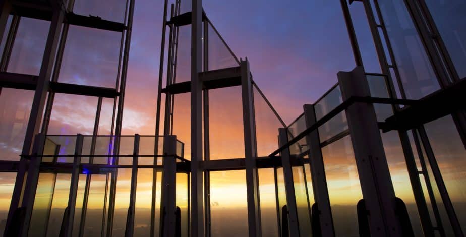 Visitors looking across London from the open air Skydeck