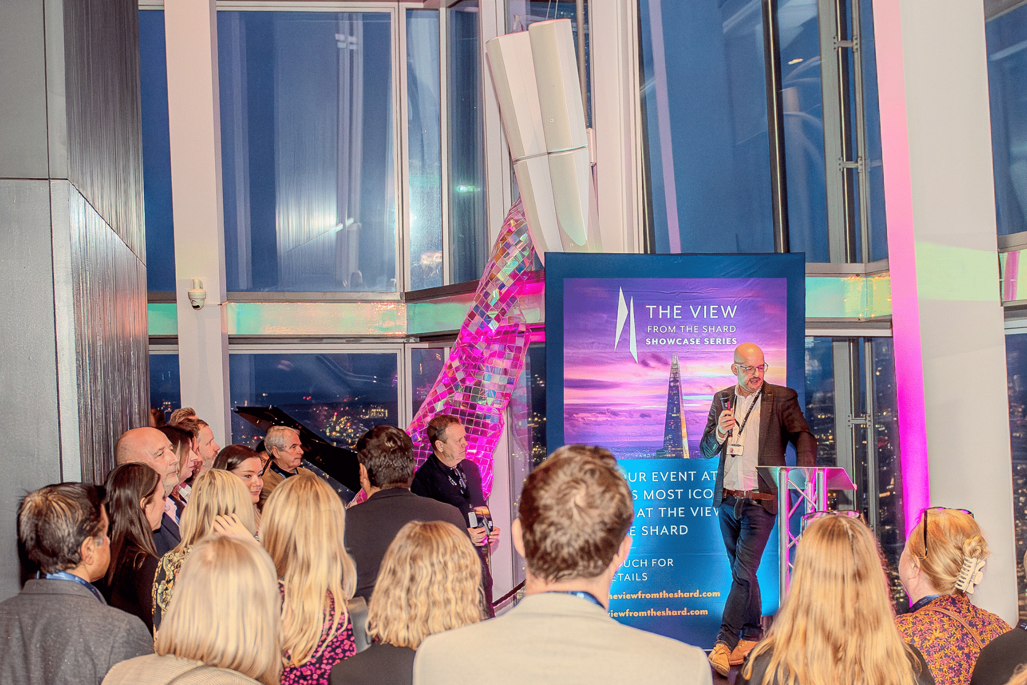 A speaker addressing an audience at an event inside The View from The Shard