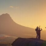 Travellers hiking along a mountain path