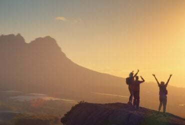 Travellers hiking along a mountain path