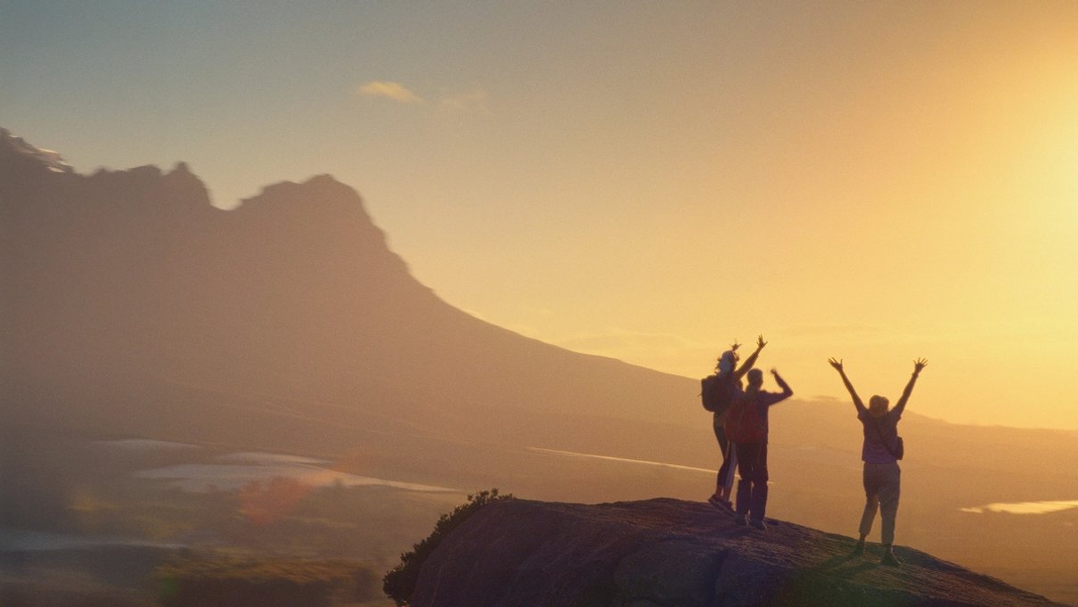 Travellers hiking along a mountain path