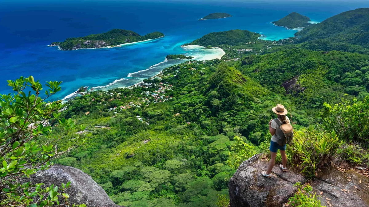 Traveller looking across a tropical island landscape