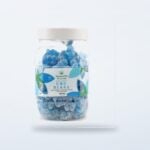 Blue CBD gummy bears in their product tub