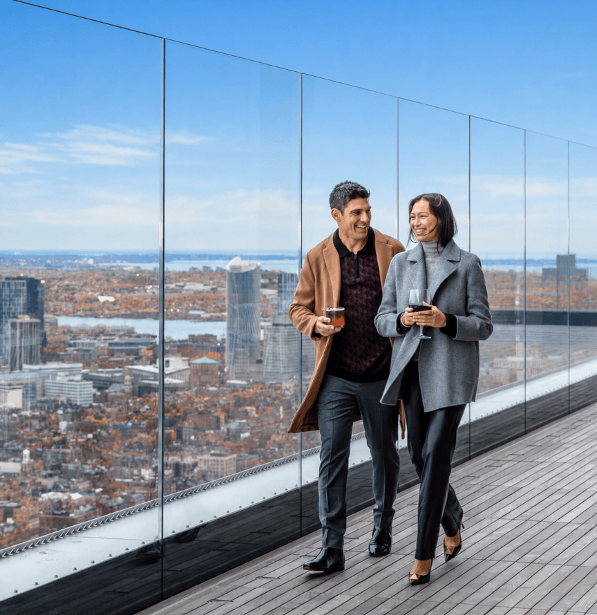 Two visitors walking through View Boston