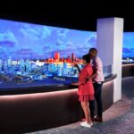 Visitors looking at an illuminated Boston city model inside View Boston
