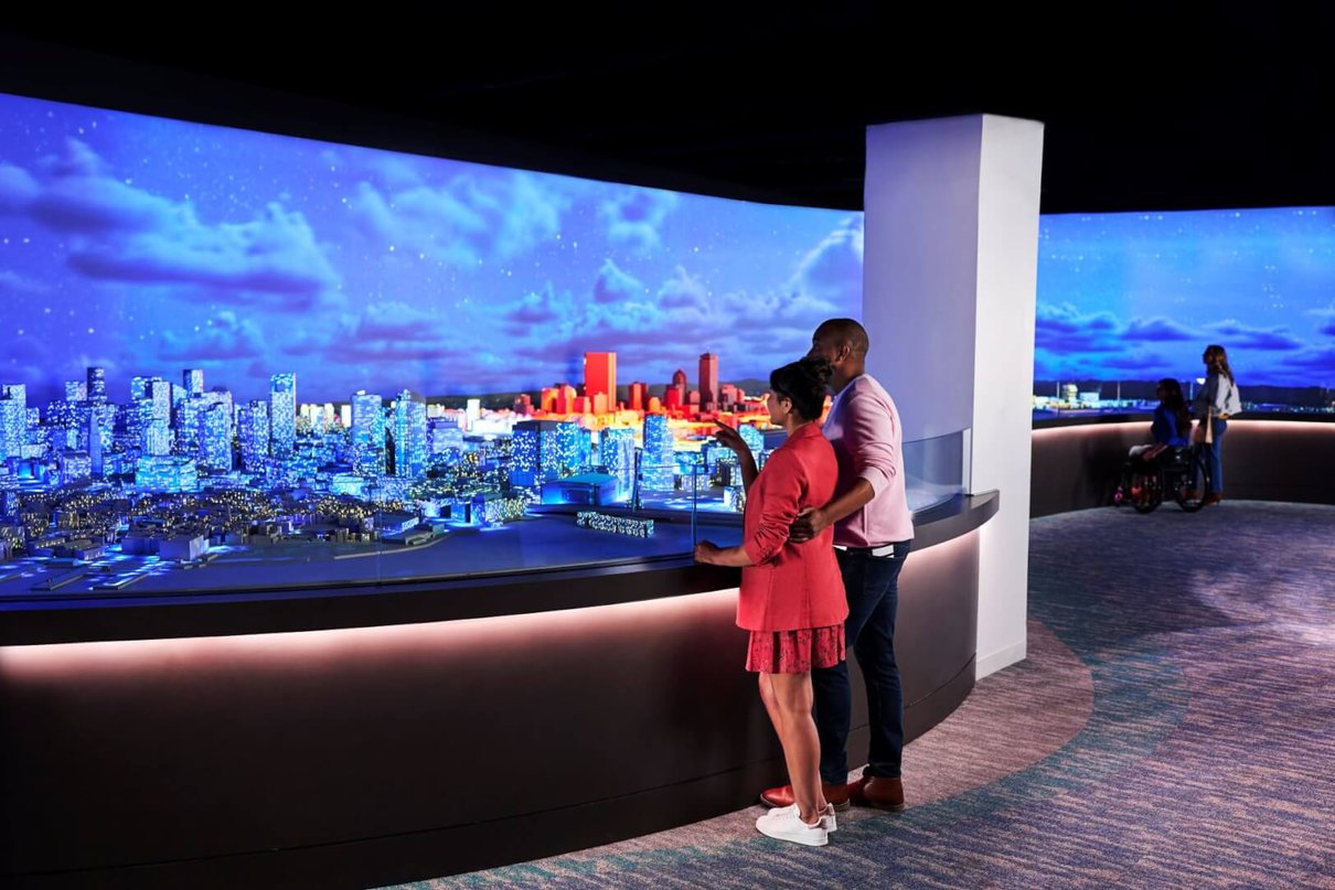 Visitors looking at an illuminated Boston city model inside View Boston