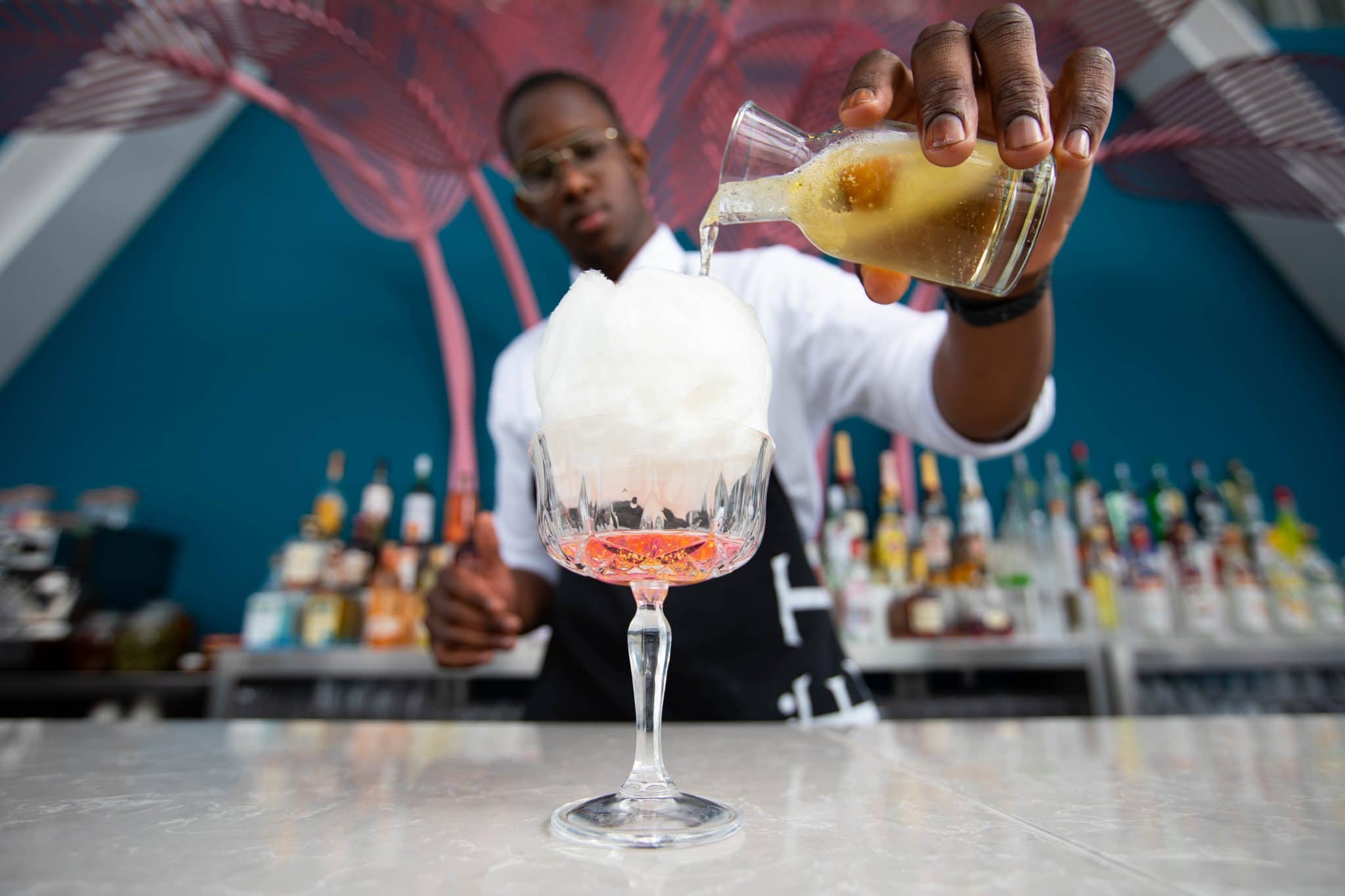 Bartender preparing a cocktail in a glass at The View from The Shard
