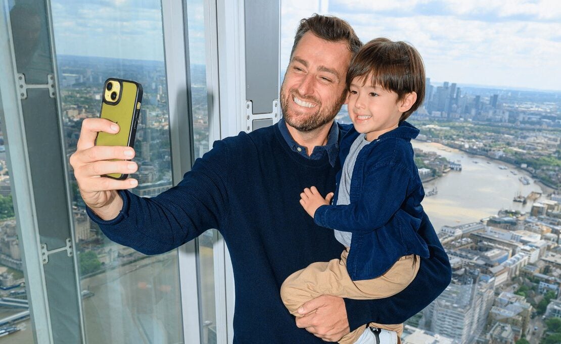 Father and child taking a selfie during a visit to The View from The Shard