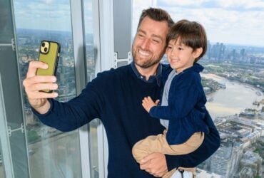 Father and child taking a selfie during a visit to The View from The Shard