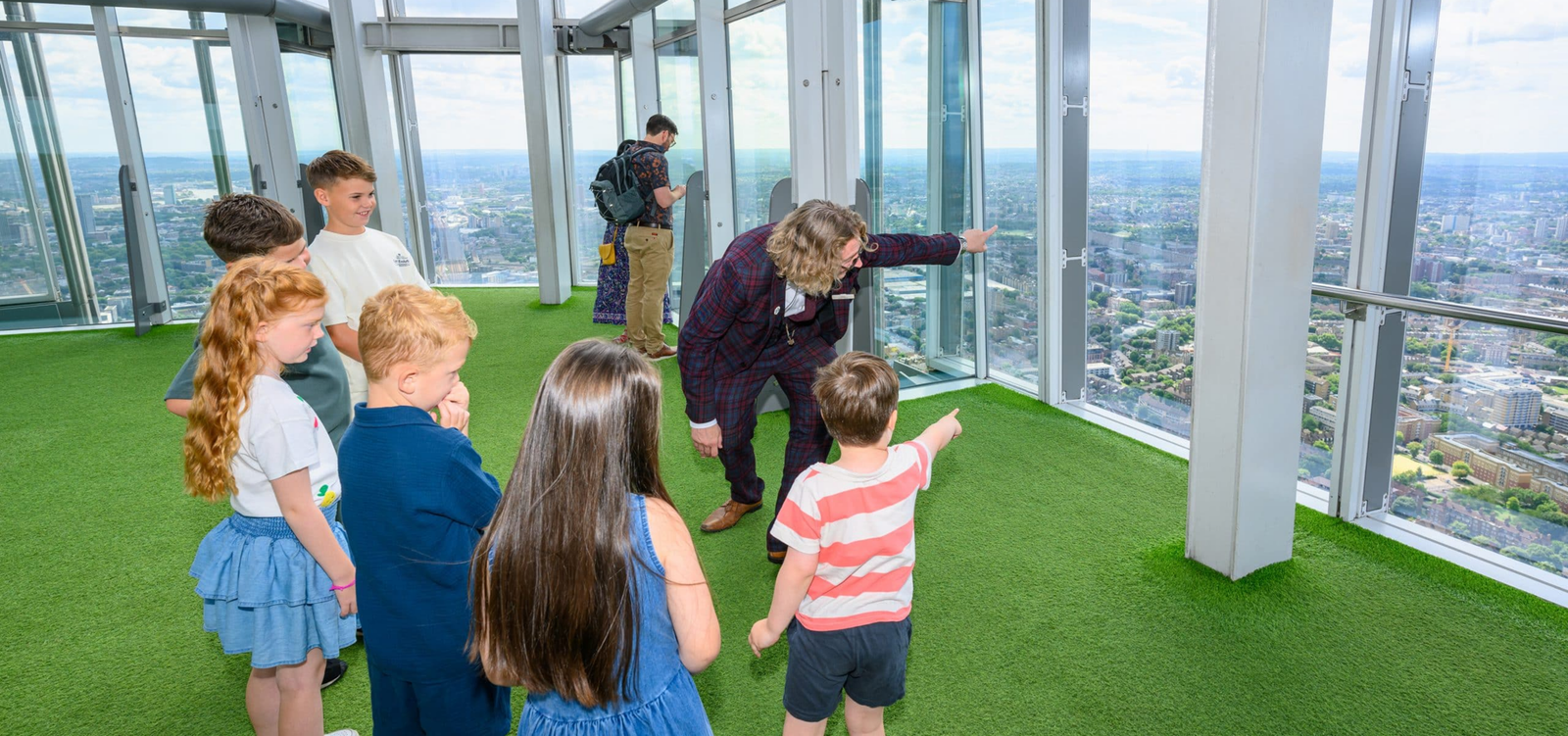 Children looking out over London at The View from The Shard